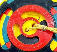 Image result for Spinning Toy with String