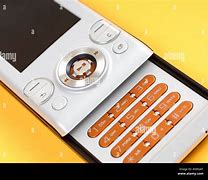 Image result for Sony Ericsson Slide Phone Black and Yellow