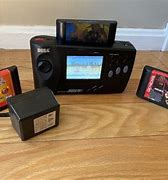 Image result for Sega Genesis Nomad with Battery Pack