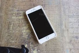 Image result for White iPhone On Table