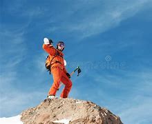 Image result for Man Standing On Mountain Painting with Skiis Orange Jacket with Backpack