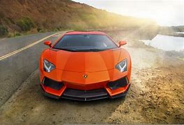 Image result for Orange Lamborghini in Grass
