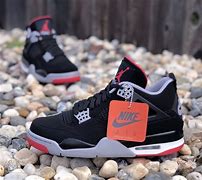 Image result for Nike Air Jordan 4 Black Cement