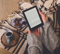Image result for Happy Woman Reading Kindle