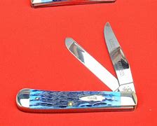 Image result for Blue Pocket Knife On a Stump