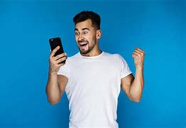 Image result for Man Looking at Cell Phone
