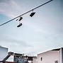 Image result for Shoes On Telephone Line