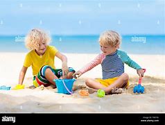 Image result for Playing in Beach Sand Getty