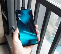 Image result for Phone with Camera That Pops Out of the Back