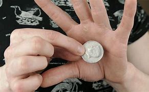 Image result for Magician Coin Trick