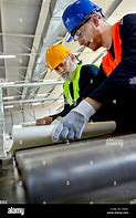 Image result for Two Men Working in a Factory