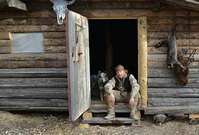 Image result for Man by Log Cabin