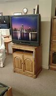 Image result for Wooden Swivel TV Stand