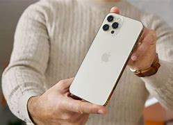 Image result for Man Holding iPhone 14 Proma
