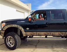Image result for Lifted Camo Ford Trucks