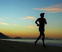 Image result for person jogging beach
