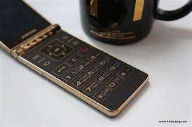 Image result for Old Gold Flip Phone with Keyboard