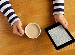Image result for Reading Kindle Coffee