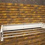 Image result for Collapsible Drying Rack Wall Mount