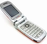 Image result for Silver Sony Flip Keyboard Phone