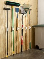 Image result for Yard Tool Hangers for Wall