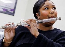 Image result for Lizzo Plays Historic Flute