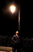 Image result for Man Standing Fare in the Dark