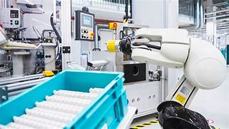 Image result for Robot Working in the Light Out Factory
