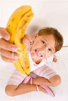 Image result for Little Girl Holding a Banana