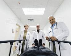 Image result for Doctor Looking at Paitent in Surgery