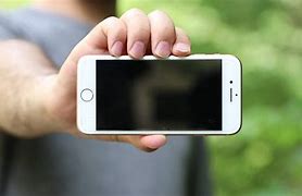 Image result for Apple Phone Held by Hand