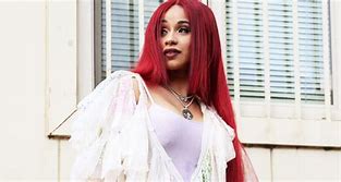 Image result for Cardi B with Yellow Hair and Black and White Suit