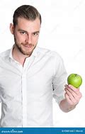 Image result for Man in Blue Shirt Holding an Apple