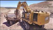 CAT 6015B Excavator Loading 100 Ton Haul Trucks