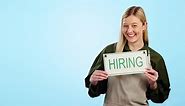 Hiring, sign and job vacancy with a waitress pointing to advertising mockup on a blue background