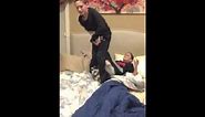 "WWE" wrestling on the bed