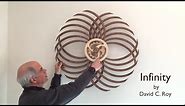 Winding the Infinity Kinetic Sculpture by David C. Roy