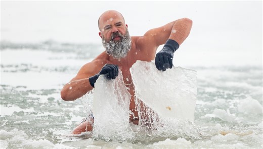 Winter lake swimmers get a polar plunge with a stress relief chaser