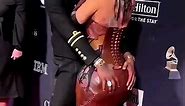 Cardi B and Offset french kissing at the Pre-Grammy Gala