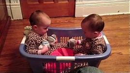 Twin Babies Talking in a Laundry Basket