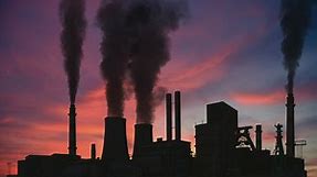 Industrial factory chimneys making a lot of smoke - Free Stock Video