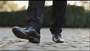 closeup of luxury shoes businessman walking elegant rich person man in black shoes