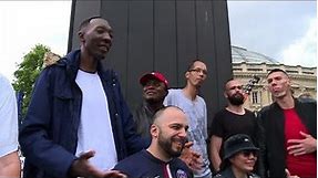 World's tallest people stroll the streets of Paris