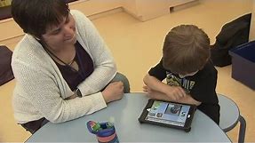 Non-verbal children living with autism learning to communicate via electronic devices