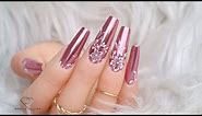 Pink Mirror Chrome Nails with easy white flowers.