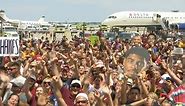 Cavs arrive to swarm of fans in Cleveland