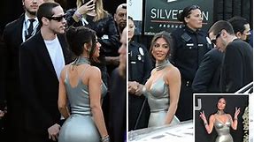 Kim Kardashian and Pete Davidson make red carpet debut as star stuns in plunging silver dress at new Hulu
