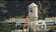 New Warner Brothers Blue Shield Logo Being Painted on Water Tower