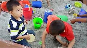 Kids play in the sand box Silver Bear Preschool