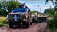 Ukrainian Bushmaster MRAP (Fresh-Brand-New From Australia) Towing A Newly Captured Russian BTR-80